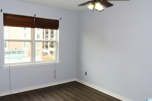 unfurnished room featuring ceiling fan and dark hardwood / wood-style floors