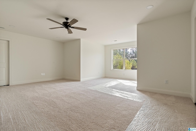 carpeted empty room with ceiling fan