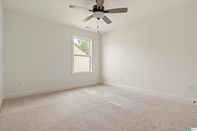 carpeted empty room with ceiling fan