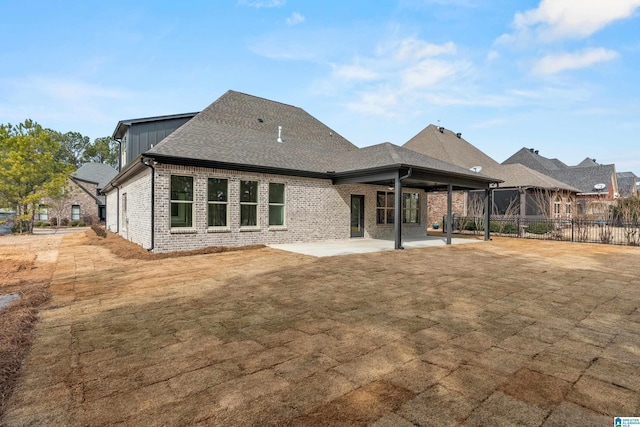 back of property featuring a patio