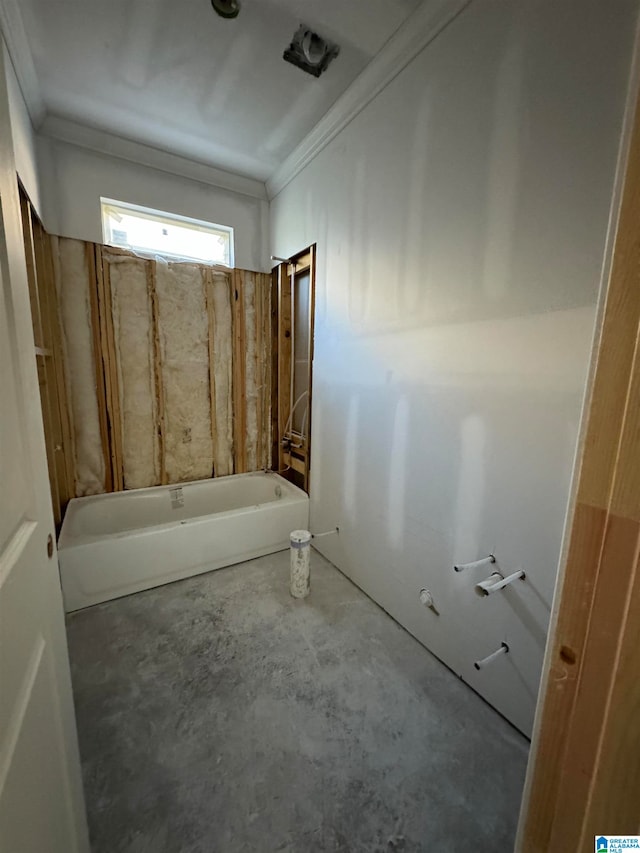 bathroom featuring concrete flooring and a tub to relax in