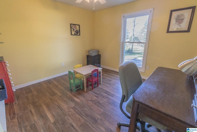 office featuring dark hardwood / wood-style floors and ceiling fan