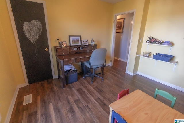 home office with dark wood-type flooring