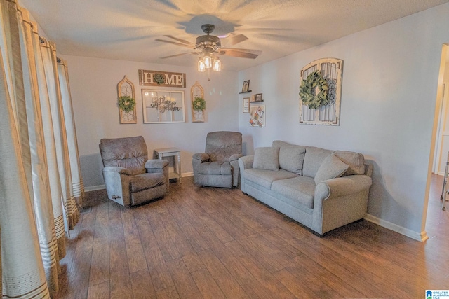 living room featuring hardwood / wood-style flooring and ceiling fan