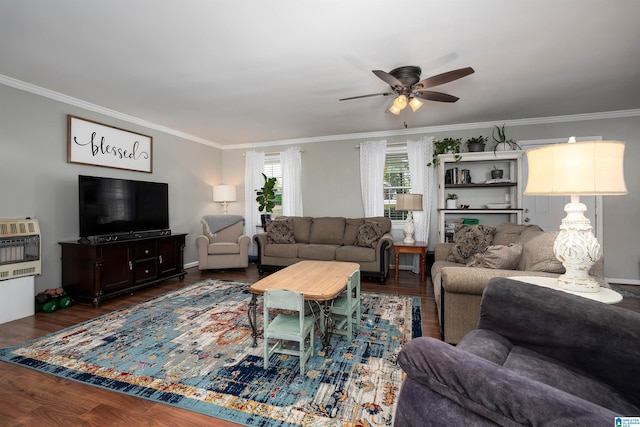 living room featuring heating unit, dark hardwood / wood-style flooring, and crown molding