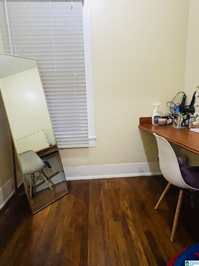 home office with dark wood-type flooring