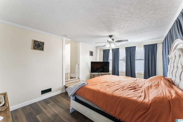 bedroom with a textured ceiling, ceiling fan, crown molding, and dark hardwood / wood-style floors