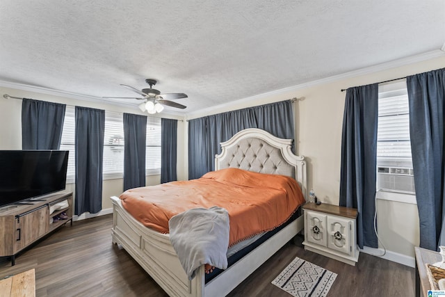 bedroom featuring dark hardwood / wood-style floors, ceiling fan, and ornamental molding