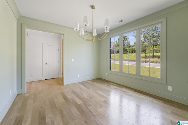 6558 Deerfoot Crossing Rd, Trussville, AL 35173 - empty room featuring a chandelier, light wood finished floors, and baseboards