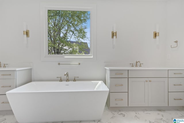 6558 Deerfoot Crossing Rd, Trussville, AL 35173 - bathroom with marble look tile flooring, vanity, and a freestanding bath
