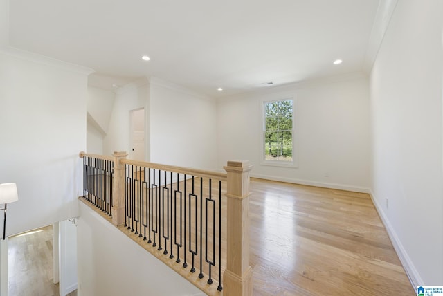 6558 Deerfoot Crossing Rd, Trussville, AL 35173 - hall with wood finished floors, an upstairs landing, ornamental molding, recessed lighting, and baseboards