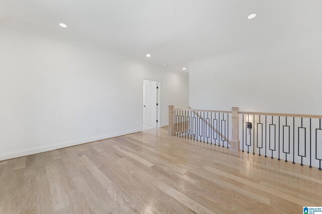6558 Deerfoot Crossing Rd, Trussville, AL 35173 - empty room with wood finished floors, crown molding, recessed lighting, and baseboards