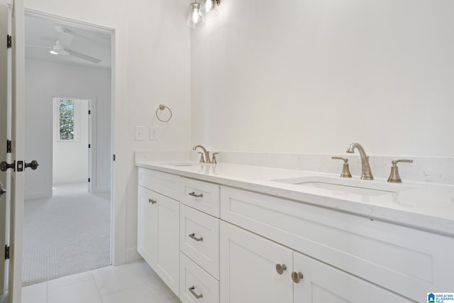 6558 Deerfoot Crossing Rd, Trussville, AL 35173 - bathroom with a ceiling fan, double vanity, and baseboards