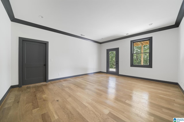 6558 Deerfoot Crossing Rd, Trussville, AL 35173 - empty room featuring ornamental molding, baseboards, and light wood-style flooring