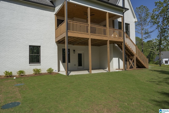 6558 Deerfoot Crossing Rd, Trussville, AL 35173 - rear view of house with a patio area, a yard, a shingled roof, stairs, and a deck