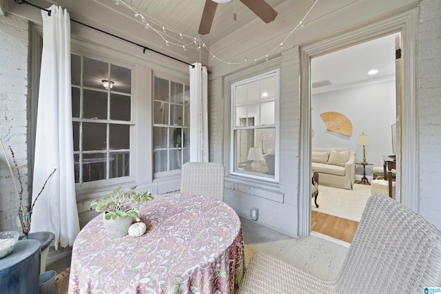 sunroom / solarium with ceiling fan and wooden ceiling