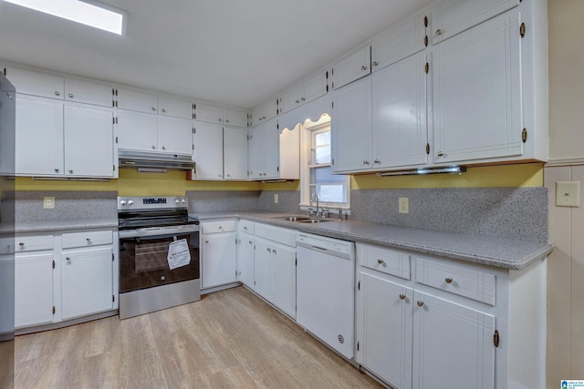 kitchen with white cabinets, light hardwood / wood-style flooring, stainless steel range with electric stovetop, and white dishwasher