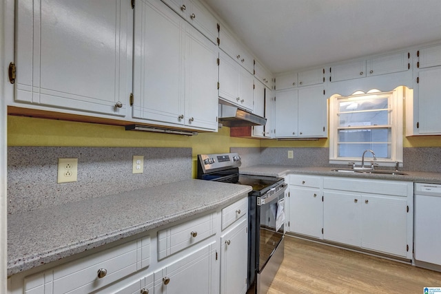 kitchen featuring stainless steel electric range, white dishwasher, sink, white cabinetry, and light hardwood / wood-style flooring