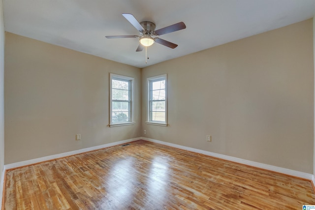 empty room featuring light hardwood / wood-style floors and ceiling fan