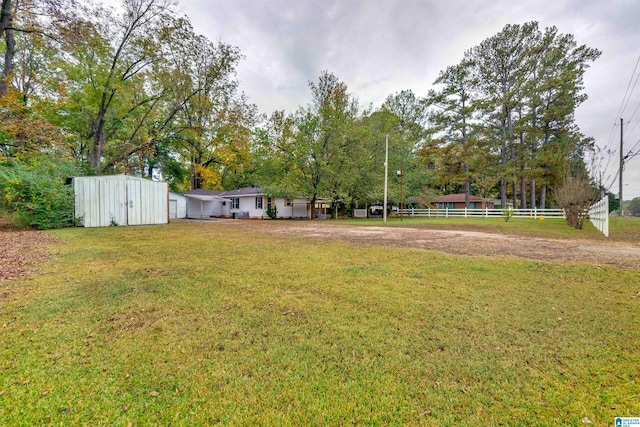 view of yard with a storage shed