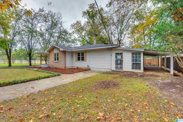 back of house featuring a yard