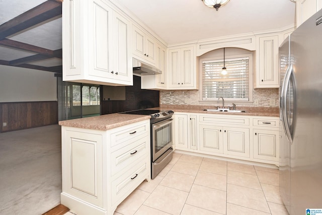 kitchen featuring stainless steel appliances, beamed ceiling, sink, light tile patterned floors, and pendant lighting