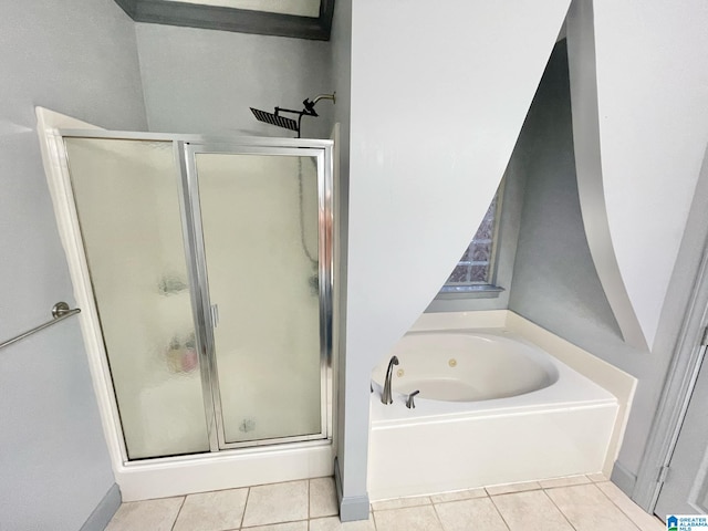 bathroom with independent shower and bath and tile patterned flooring