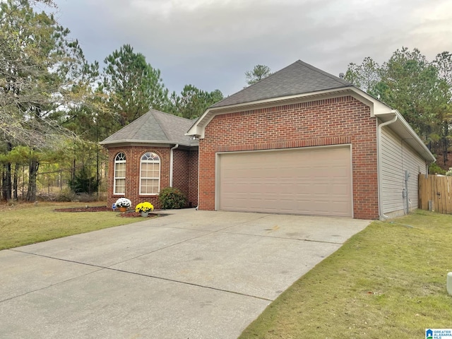 view of front of home with a garage and a front yard