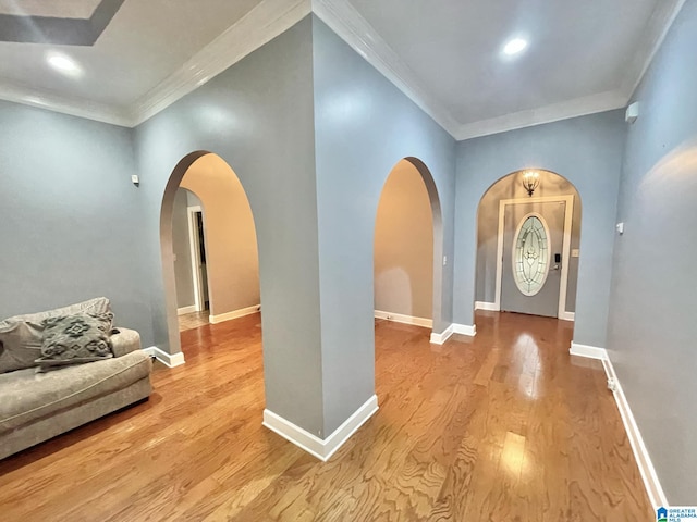 entryway featuring light hardwood / wood-style flooring and ornamental molding