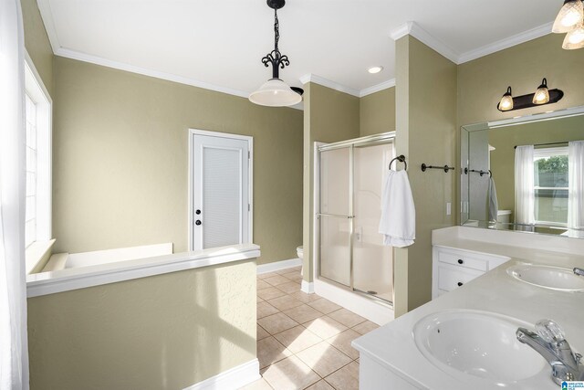 bathroom with vanity, a shower with shower door, tile patterned flooring, and crown molding