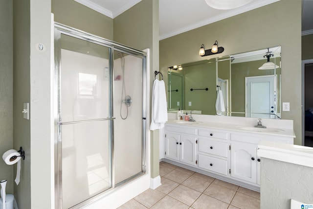 bathroom featuring ornamental molding, vanity, tile patterned floors, and a shower with shower door