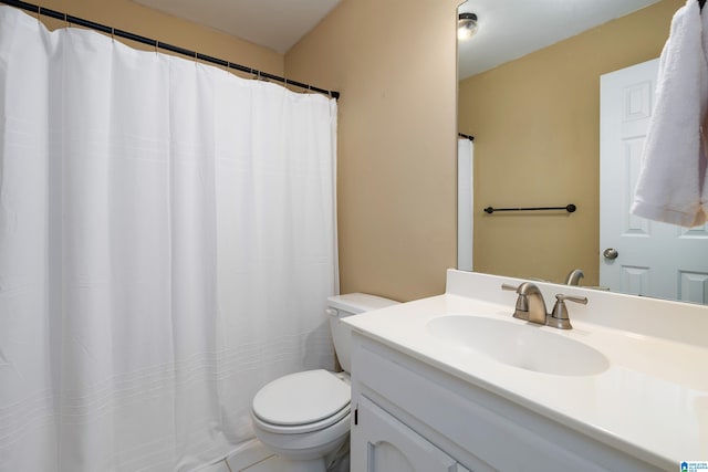 bathroom with vanity, tile patterned floors, and toilet