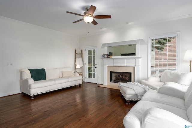 living room featuring dark wood-type flooring, ceiling fan, and crown molding