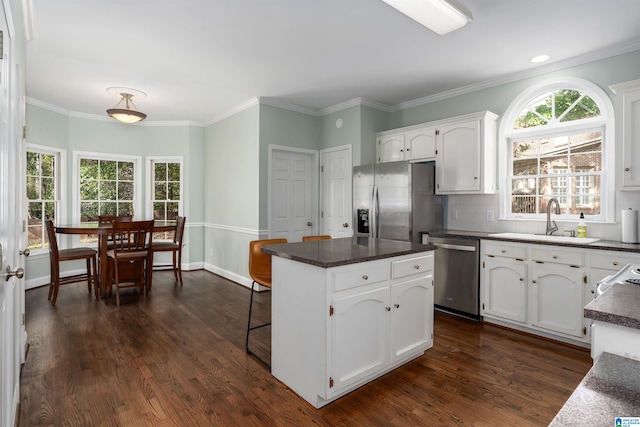 kitchen featuring white cabinetry, stainless steel appliances, dark hardwood / wood-style floors, and sink