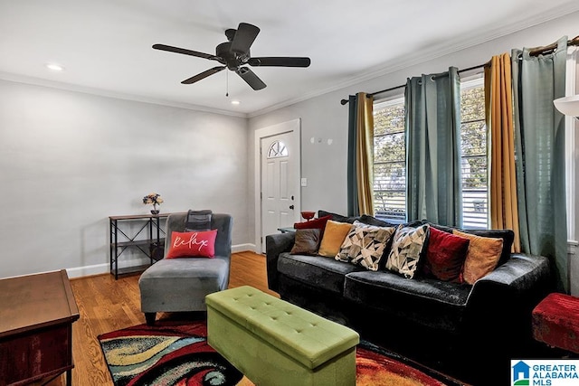 living room with crown molding, hardwood / wood-style flooring, and ceiling fan