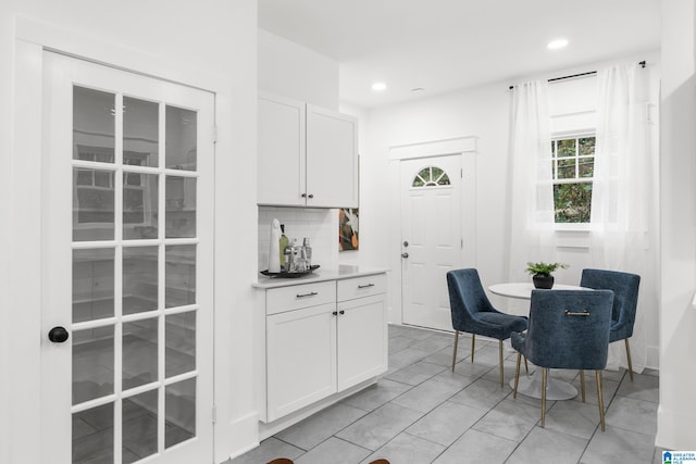 dining space with light tile patterned floors