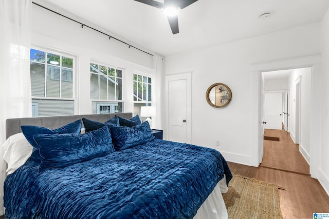 bedroom featuring wood-type flooring and ceiling fan