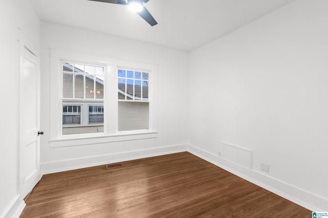 unfurnished room featuring hardwood / wood-style flooring and ceiling fan