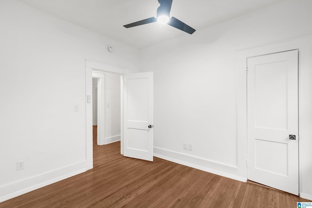 unfurnished bedroom with hardwood / wood-style floors and ceiling fan