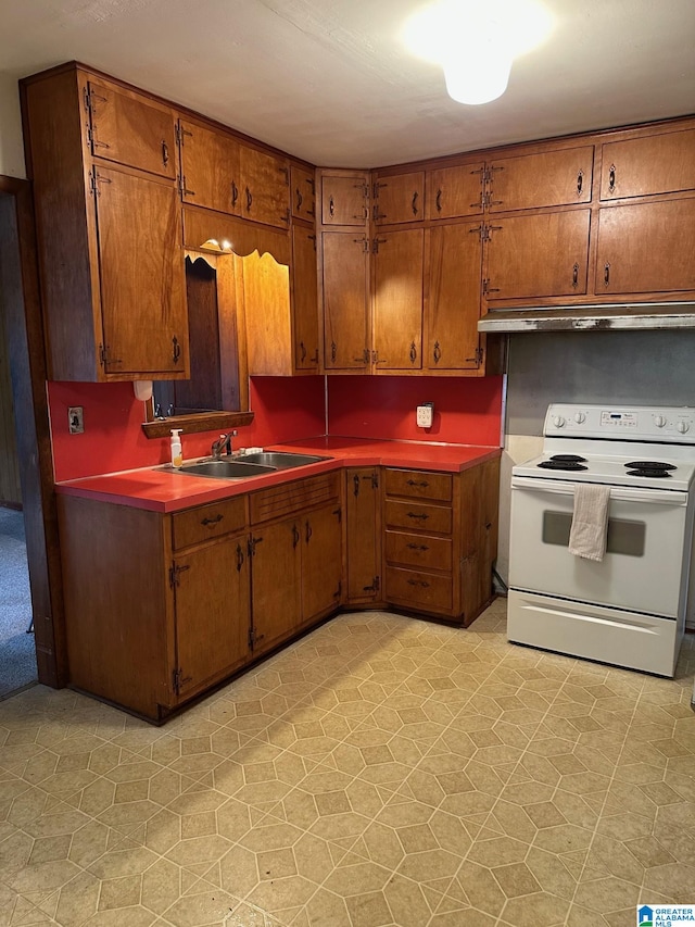 kitchen featuring white electric stove and sink