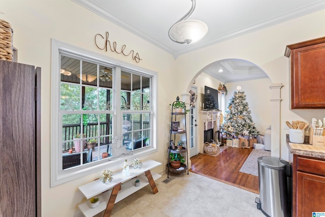 interior space with light hardwood / wood-style flooring and crown molding