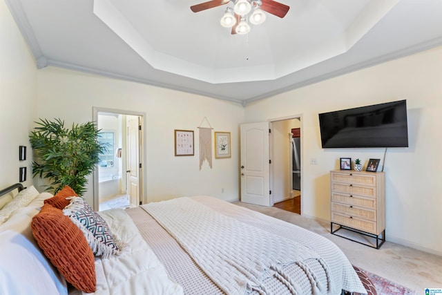 bedroom featuring ensuite bathroom, ceiling fan, a spacious closet, crown molding, and light colored carpet