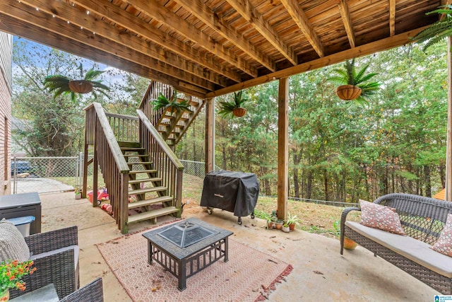 view of patio featuring a fire pit and a grill