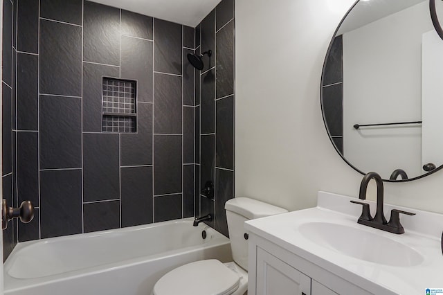 full bathroom with toilet, tiled shower / bath combo, and vanity