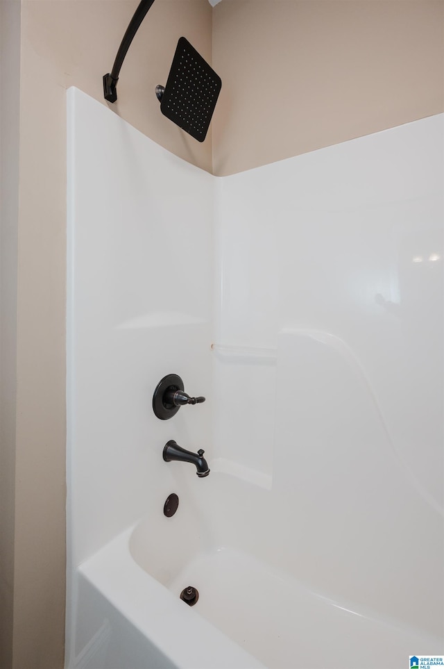 bathroom with shower / washtub combination