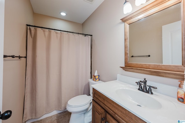 bathroom featuring a shower with shower curtain, tile patterned flooring, vanity, and toilet