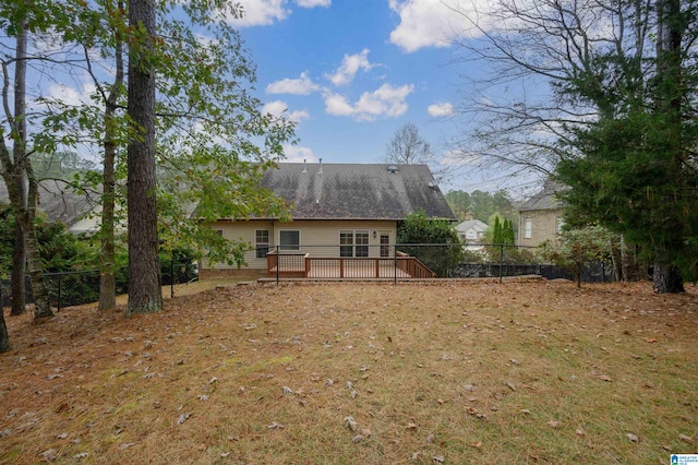 back of house featuring a deck