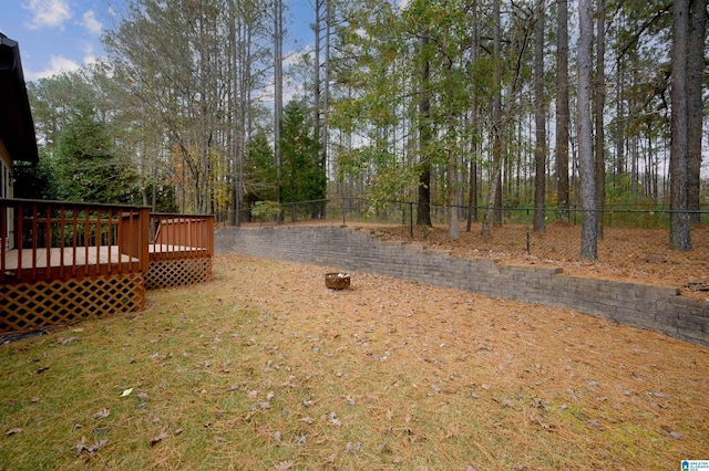 view of yard with a wooden deck