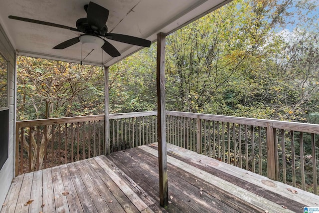 wooden deck featuring ceiling fan