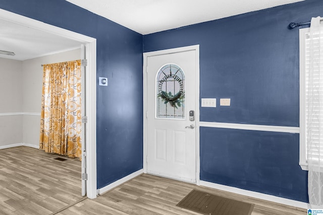 entryway with light hardwood / wood-style floors